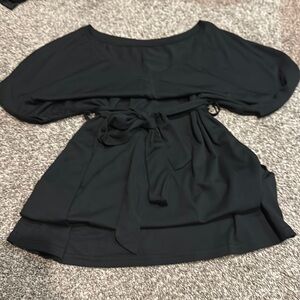 Black mini dress , shirt sleeve, ties in the back or front
